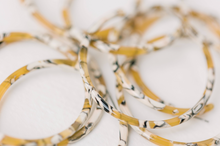 Load image into Gallery viewer, Skinny Marbled Yellow Hoop Earrings
