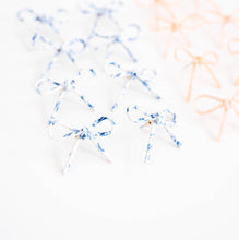 Load image into Gallery viewer, Marbled Blue and White Bow Earrings
